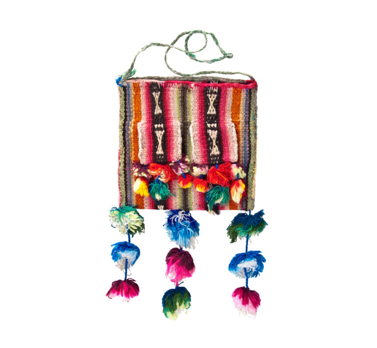 A bag woven with colors of the rainbow, a thin, light green shoulder strap, and three yarn tassels hanging from the bottom edge